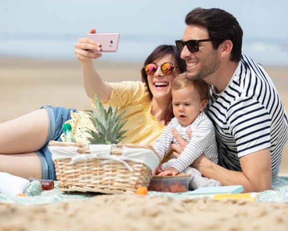 happy family spending good time at the beach together