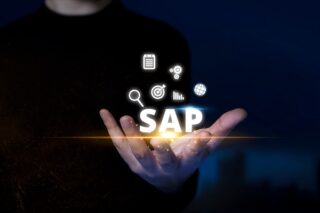 SAP: Man Holds Enterprise Icons.