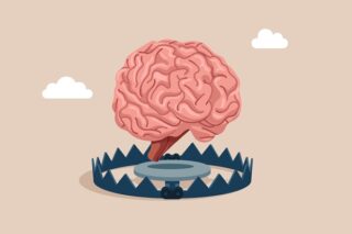 Grafik eines Gehirns oberhalb einer Bärenfalle