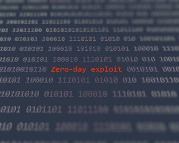 Das Wort Zero-Day Exploit in rot umgeben von Binärcode